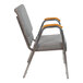A gray Flash Furniture church chair with wood armrests.