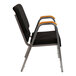 A black Flash Furniture church chair with a silver metal frame and wood accents.