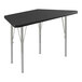 A black trapezoid activity table with silver legs.