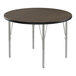 A Correll round activity table with silver metal legs and black T-mold.