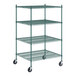 A green Regency mobile wire shelving unit with wheels.