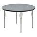 A round Correll activity table with silver metal legs and a gray granite top.