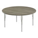 A Correll round activity table with metal legs and a gray top.