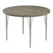 A Correll round activity table with metal legs and a driftwood gray top.