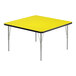 A yellow square Correll activity table with silver legs and black edge.