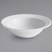 A close up of a Tuxton Concentrix white bowl with a curved edge.