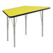 A yellow trapezoid activity table with silver legs and black trim.