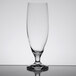A close-up of a clear Stolzle Imperial stemmed beer glass on a table with a reflection.