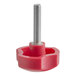 A red plastic Estella die knob with a metal screw.