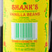 A 16 fl. oz. bottle of Shank's Imitation Vanilla with a yellow label.