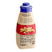 A bottle of Torani Sugar-Free White Chocolate Sauce with a blue and red label.