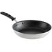 A Vollrath Wear-Ever black non-stick frying pan with a black silicone handle.