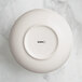 An Acopa Highlands white china bowl with a circular rim.