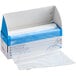 A blue and white box of clear plastic pastry bags on a roll.