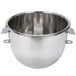 A silver Vollrath stainless steel mixing bowl with handles.