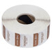 A roll of white and brown labels with black text on a black and brown circle.