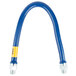 A blue flexible gas hose with a yellow label.