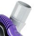 A purple and white ProTeam vacuum cleaner attachment with a purple Xover tool.