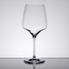 A Stolzle Burgundy wine glass on a table.