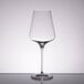 A close-up of a clear Stolzle Quatrophil Bordeaux wine glass.