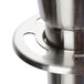 A satin stainless steel Aarco rope style crowd control stanchion.