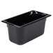 A black plastic Vollrath food pan on a counter.
