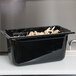 A black Vollrath polycarbonate food pan with food inside.