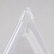 A clear plastic triangle-shaped lid with slotted openings.
