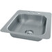 A stainless steel Advance Tabco single bowl drop-in sink with a drain.
