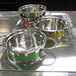 A Bon Chef green stainless steel steam table pot with riveted handles.
