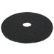 A black Scrubble stripping floor pad with a hole in the middle.