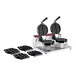 A black Estella double Belgian waffle maker with two waffles on a stick plates.