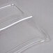 A clear Fineline plastic dome lid on a clear plastic container.