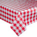 A red and white checkered Intedge vinyl table cover on a table.