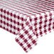 A close-up of a burgundy and white checkered Intedge vinyl table cover on a table.