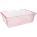A clear plastic Carlisle food storage box with red trim and a lid.