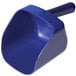 A blue plastic scoop with a handle in front of a Manitowoc undercounter ice machine.