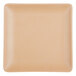 A square plate with a beige color.