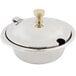 A silver stainless steel Bon Chef mini chafing dish with a lid and a gold handle.