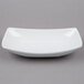 An American Metalcraft oval stoneware bowl in white on a gray background.