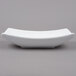 An American Metalcraft white stoneware bowl with a long, thin oval shape.