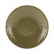 A close-up of an Elite Global Solutions round plate with a metallic pebble finish designed to look like lizard skin.
