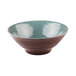 A close-up of an Elite Global Solutions Pebble Creek Abyss-colored bowl with a brown and light blue rim.