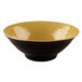 An olive oil-colored bowl with a yellow rim.