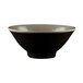 A black bowl with a white rim.