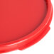 A red Carlisle round polypropylene lid.