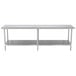 A long stainless steel Advance Tabco work table with a stainless steel undershelf.