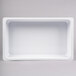 A white rectangular melamine food pan with a white border.