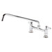 A chrome Equip by T&S deck-mounted faucet with a 16 1/8" swing spout and lever handles.