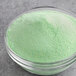 A container of mint green Great Western cotton candy sugar.
